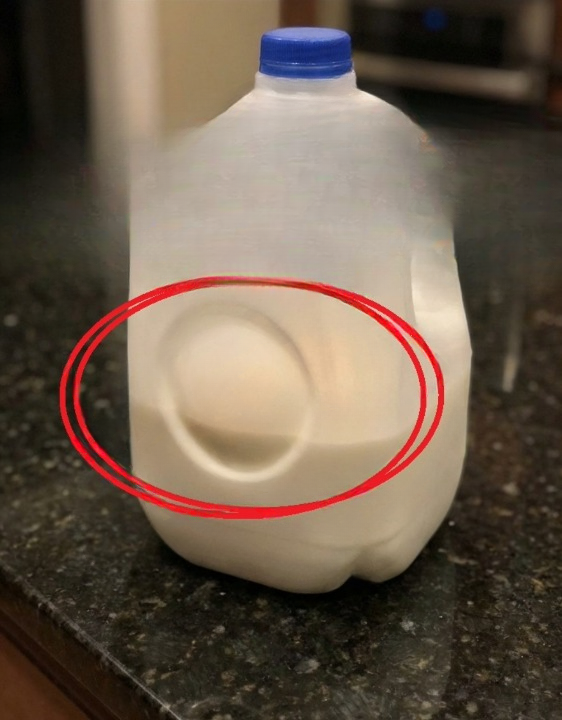 Why Milk Jugs Have a Round Indentation: The Smart Engineering Behind a Simple Design
