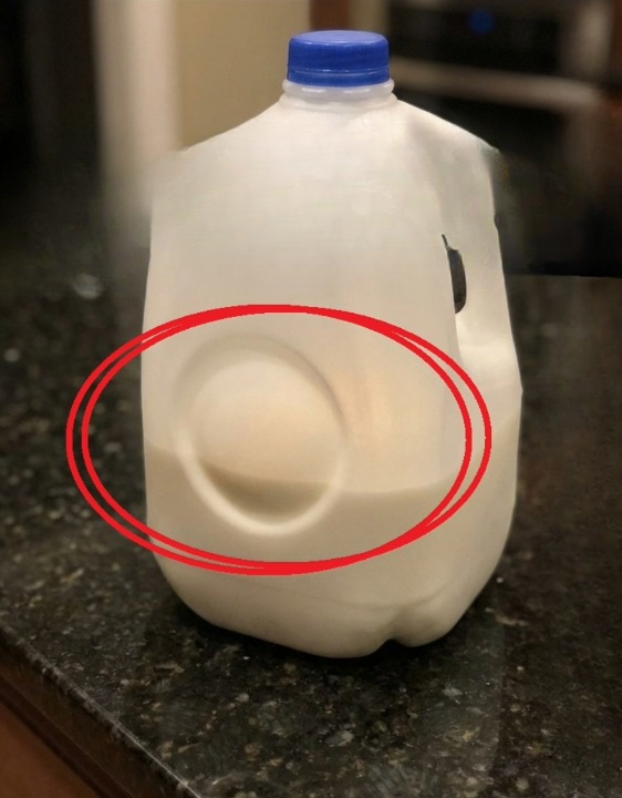 The Real Purpose of the Circular Dent on Milk Jugs: The Clever Design Detail Most People Never Notice
