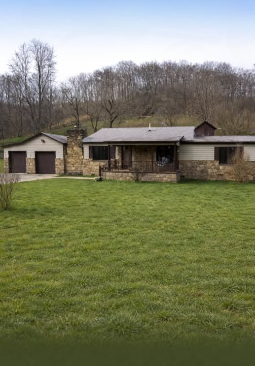 Charming Ranch-Style Home with Timeless Stone Details and Relaxing Outdoor Living