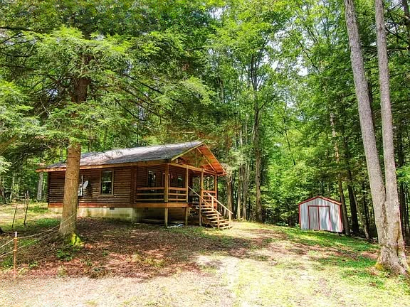 Secluded Log Cabin Retreat on 6.6 Wooded Acres with Creek — A Private Escape Designed for Quiet Living in Jamestown