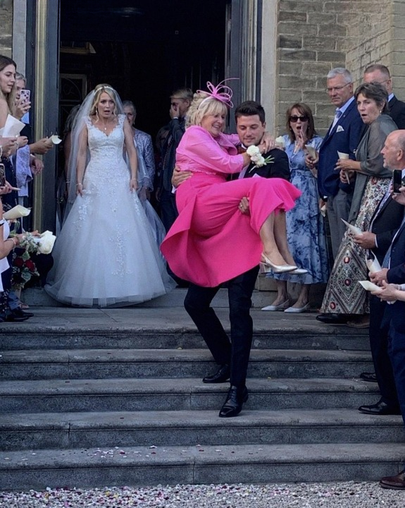 My Husband Carried His Mother Out of the Church After Our Wedding Ceremony Because “She Wanted to Experience It Too” — But My Mother’s Response Left the Entire Crowd Speechless