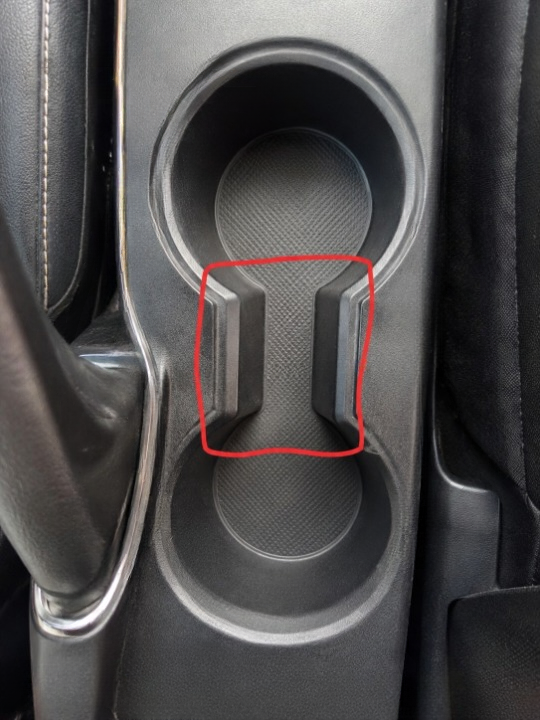 What Is the Small Gap Between Car Cup Holders Really For? The Surprising Design Detail Most Drivers Never Notice